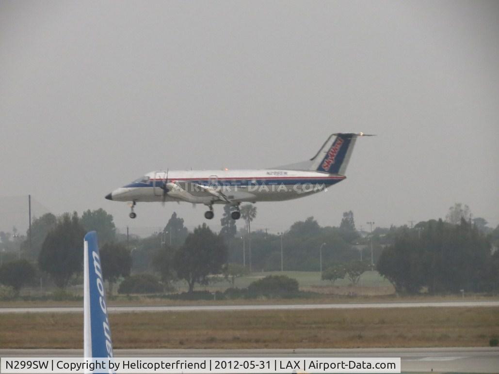 N299SW, 1997 Embraer EMB-120ER Brasilia C/N 120.329, Landing on 24R during an overcast day