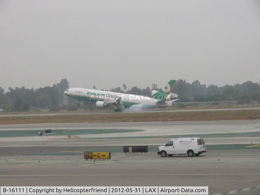 B-16111, 1998 McDonnell Douglas MD-11F C/N 48787, Smokin em on touch down on 24R