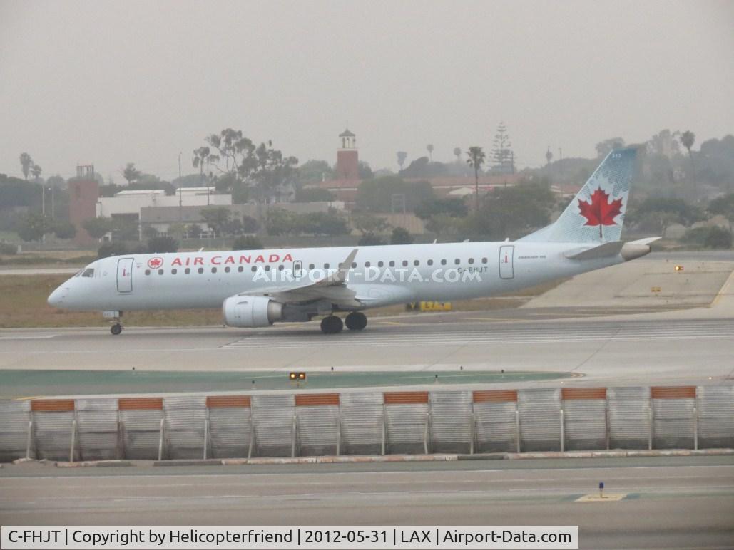 C-FHJT, 2006 Embraer 190AR (ERJ-190-100IGW) C/N 19000043, Taking off on 24L during an overcast day