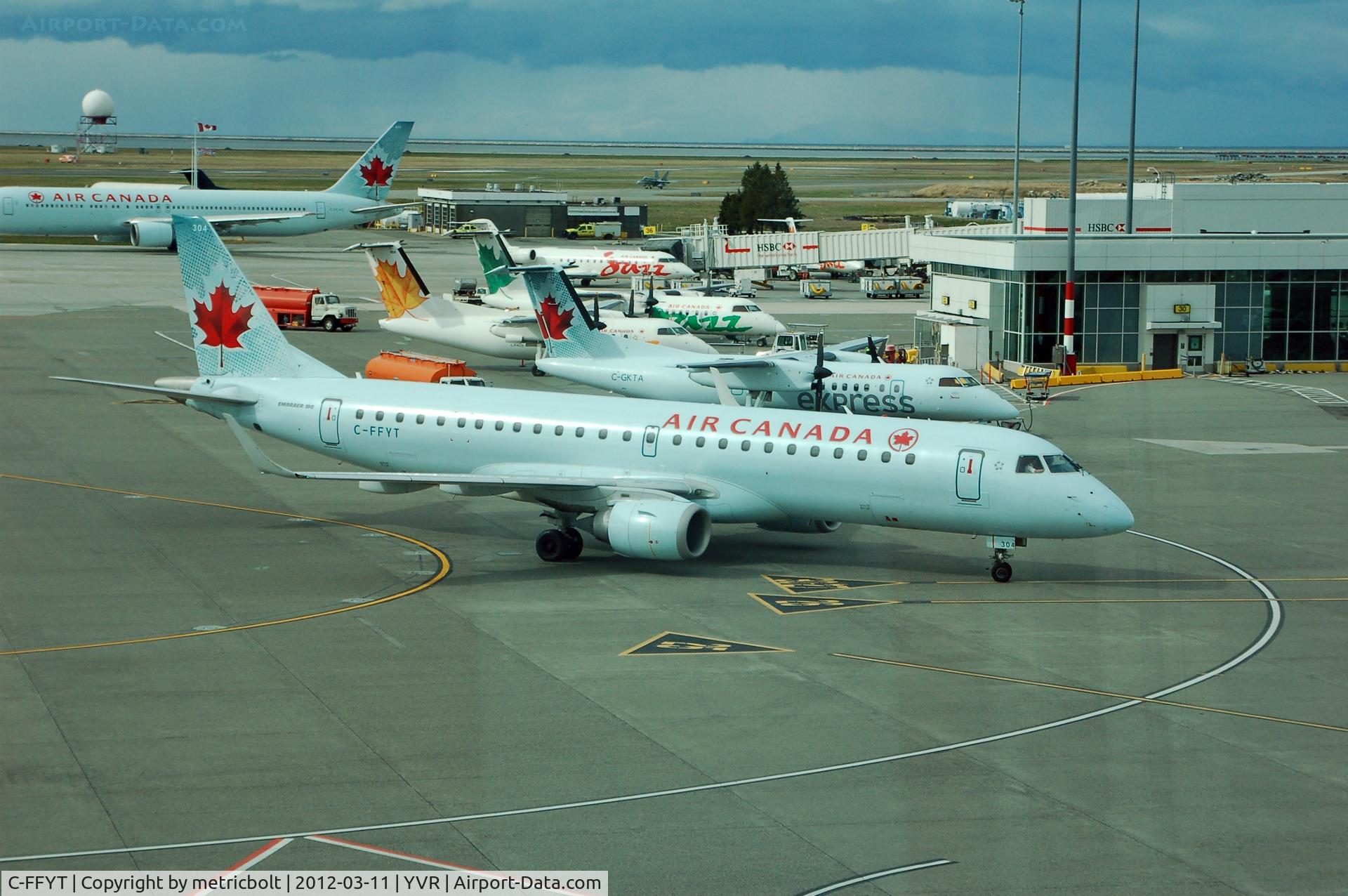 C-FFYT, 2005 Embraer 190AR (ERJ-190-100IGW) C/N 19000018, busy airport scene