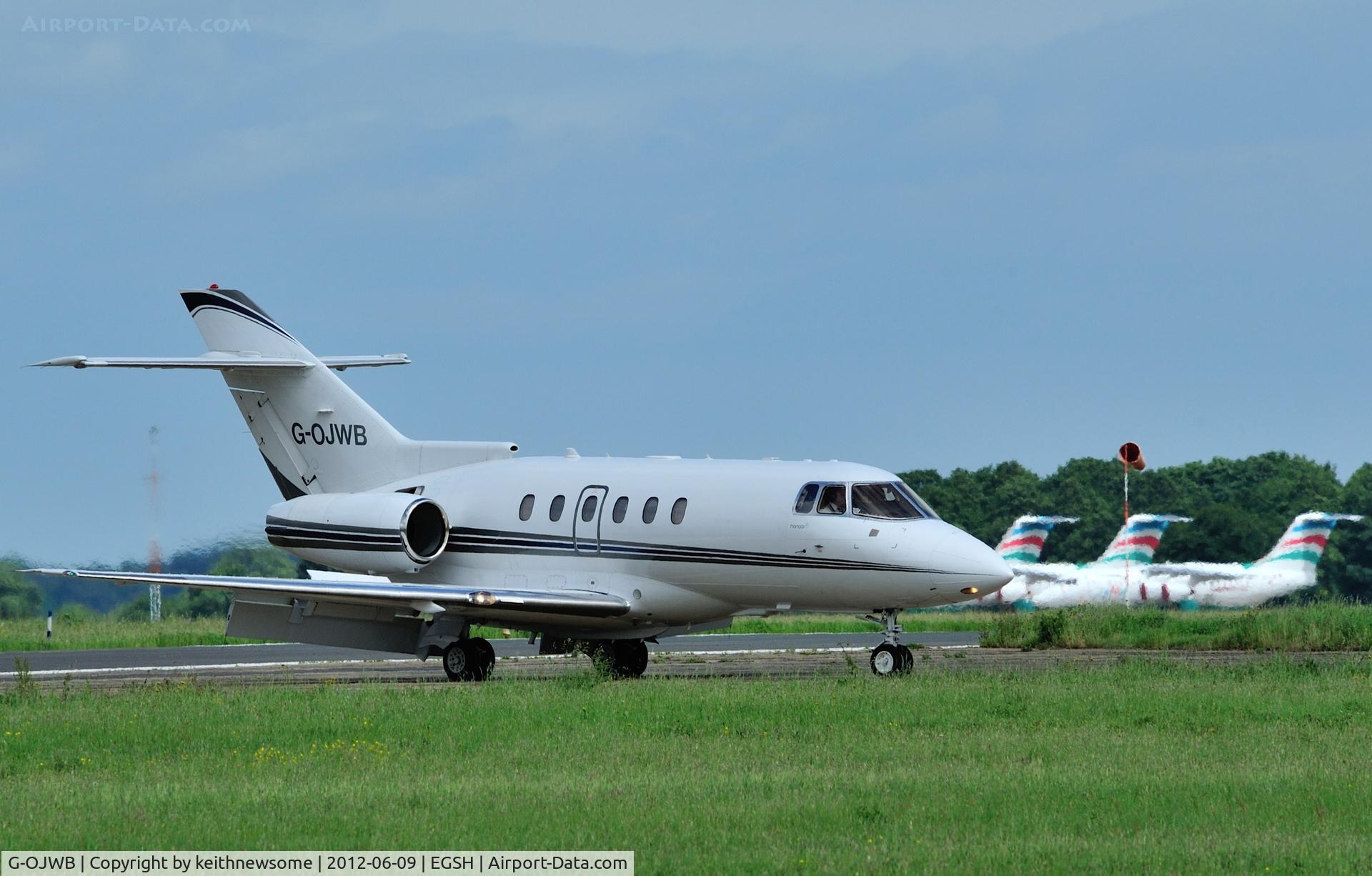 G-OJWB, 2004 Raytheon Hawker 800XP C/N 258674, G-OJWB leaving runway at Delta.