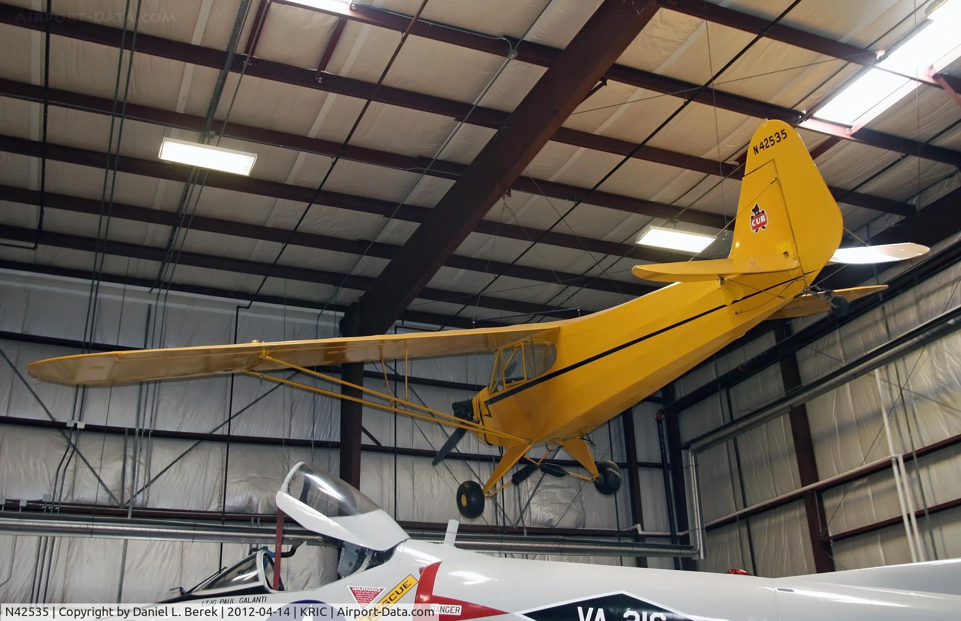 N42535, 1945 Piper J3C-65 Cub Cub C/N 14812, The A-4 Skyhawk provides a marked contrast to this 1945 Piper Cub.