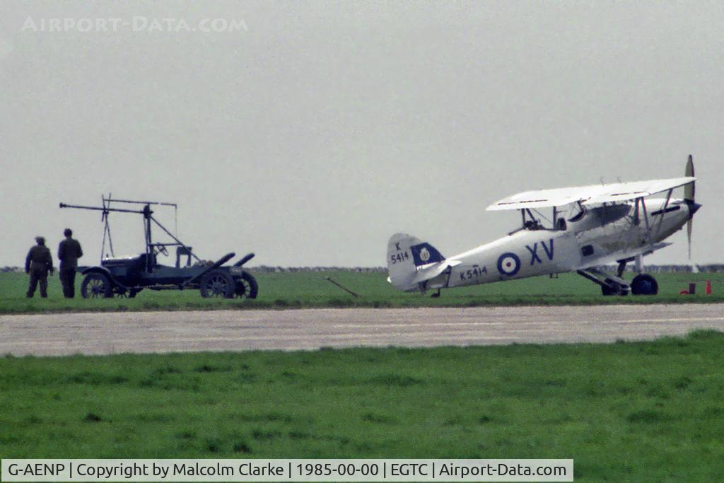 G-AENP, 1935 Hawker Hind C/N 41H/81902, A long distance shot of a Hawker Hind (Afghan) and Hucks Starter at Cranfield Airport in 1985.