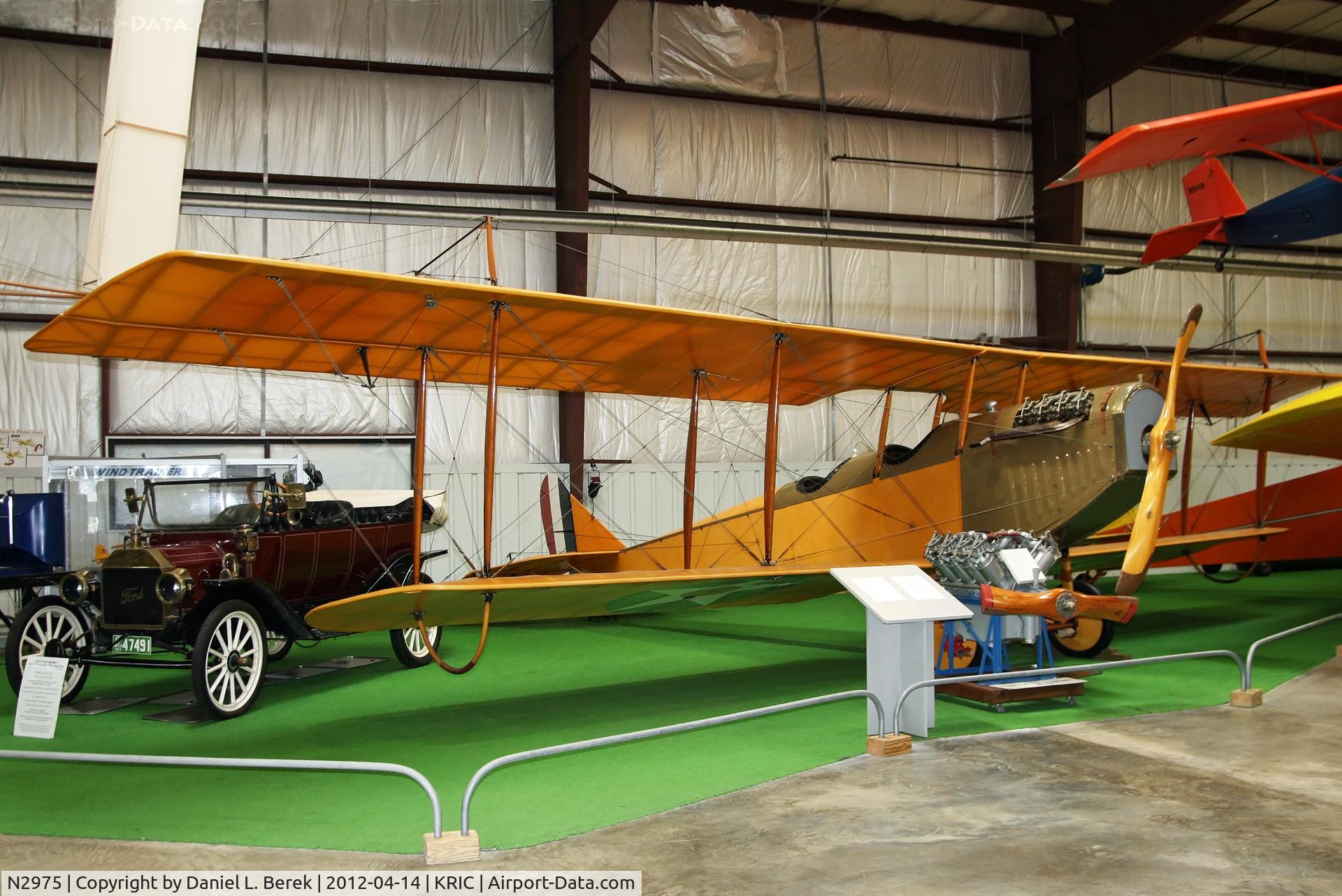 N2975, Curtiss JN-4D Jenny C/N 450, This beautiful bird has taken a 1914 Model T under her wing.  In front is a Curtiss OX-5 engine that powered the machine.