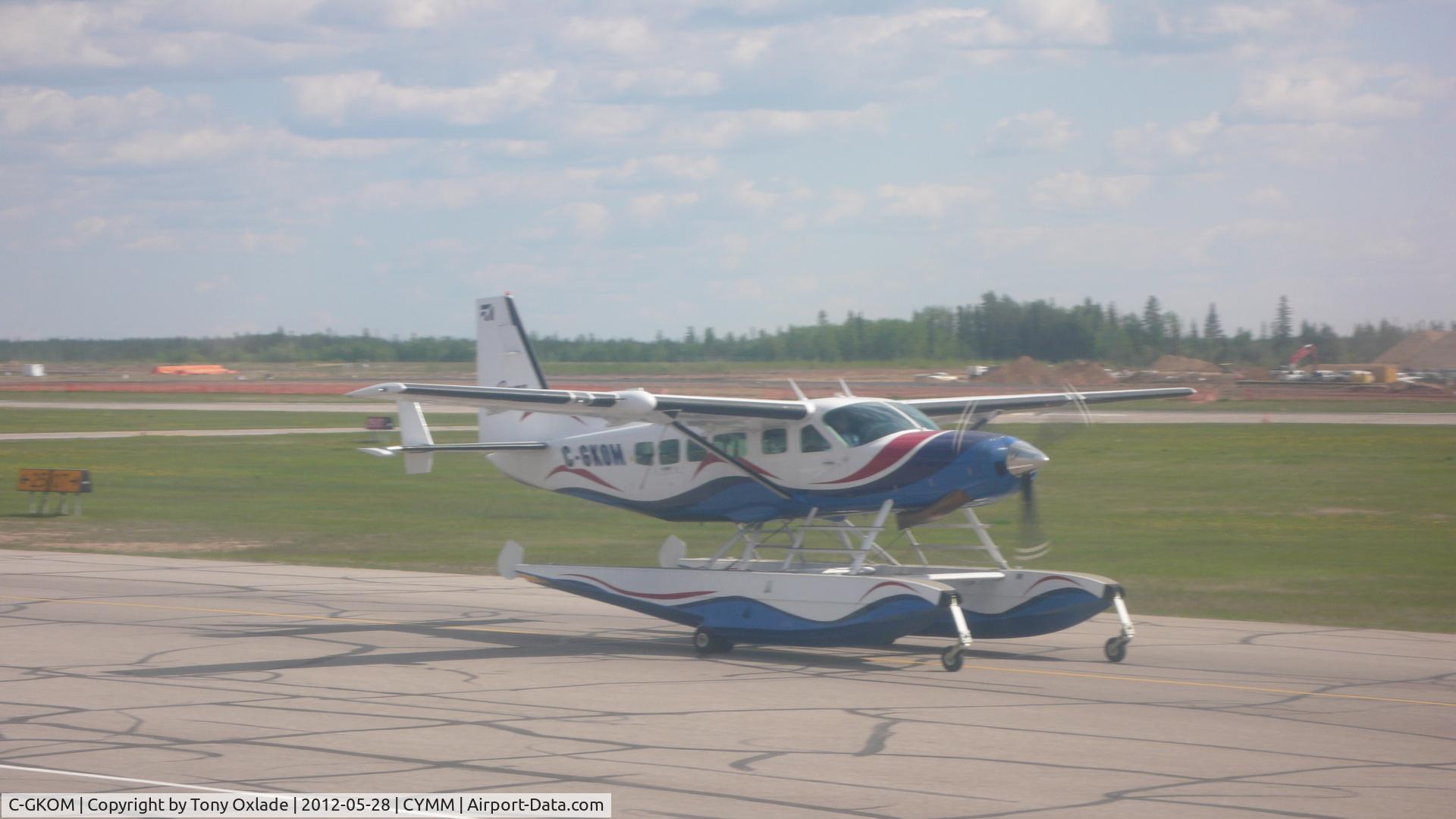 C-GKOM, 2003 Cessna 208 Caravan I C/N 20800365, Taxiying by on ramp at Fort McMurray
