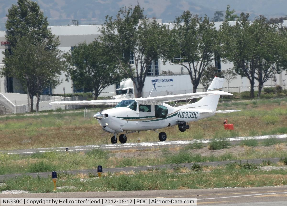 N6330C, 1980 Cessna 210N Centurion C/N 21063866, Taking off on 26L, note camera pod at the back of the fuselage