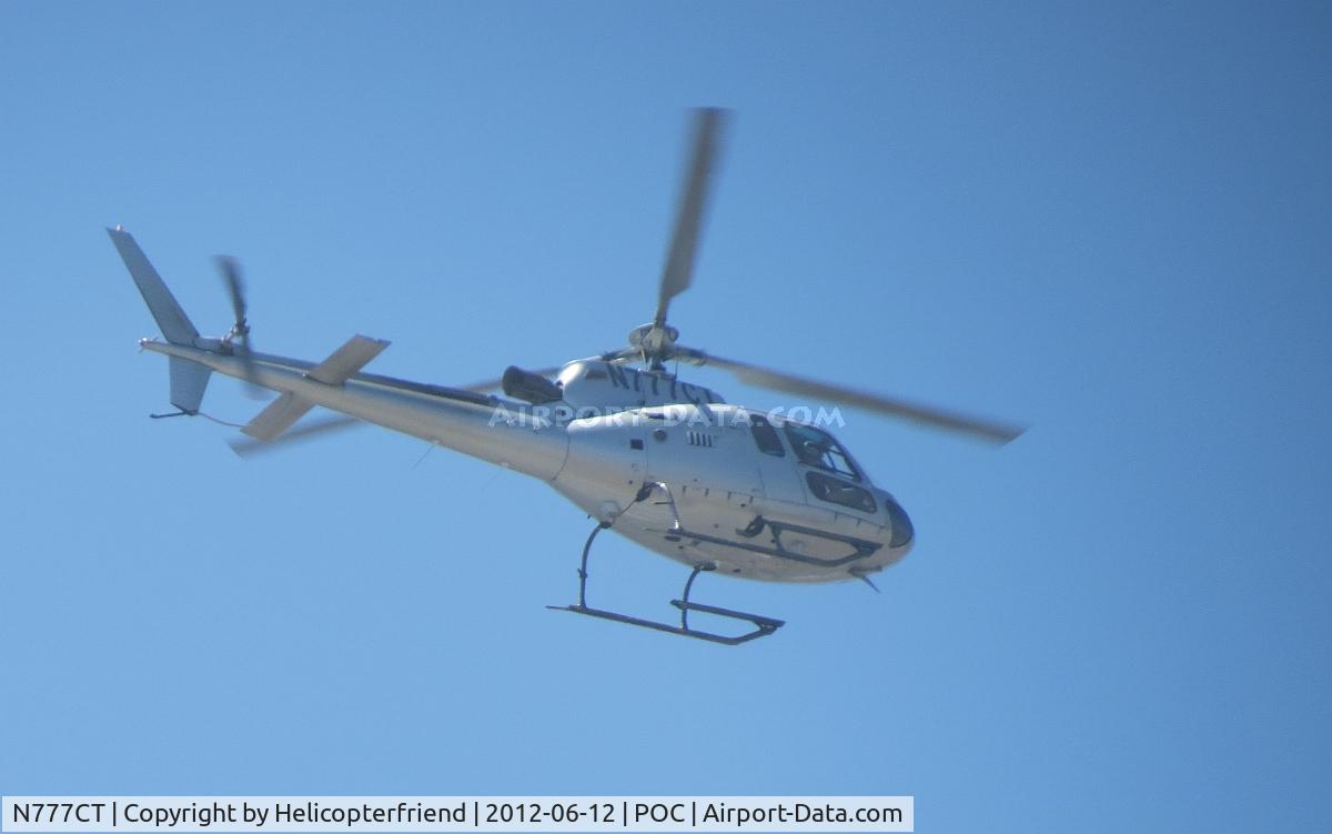 N777CT, 2001 Eurocopter AS-350B-3 Ecureuil Ecureuil C/N 3395, Behind N1883H, On a partially overcast sky, this ship received permission to fly across the active runway at or above 2500