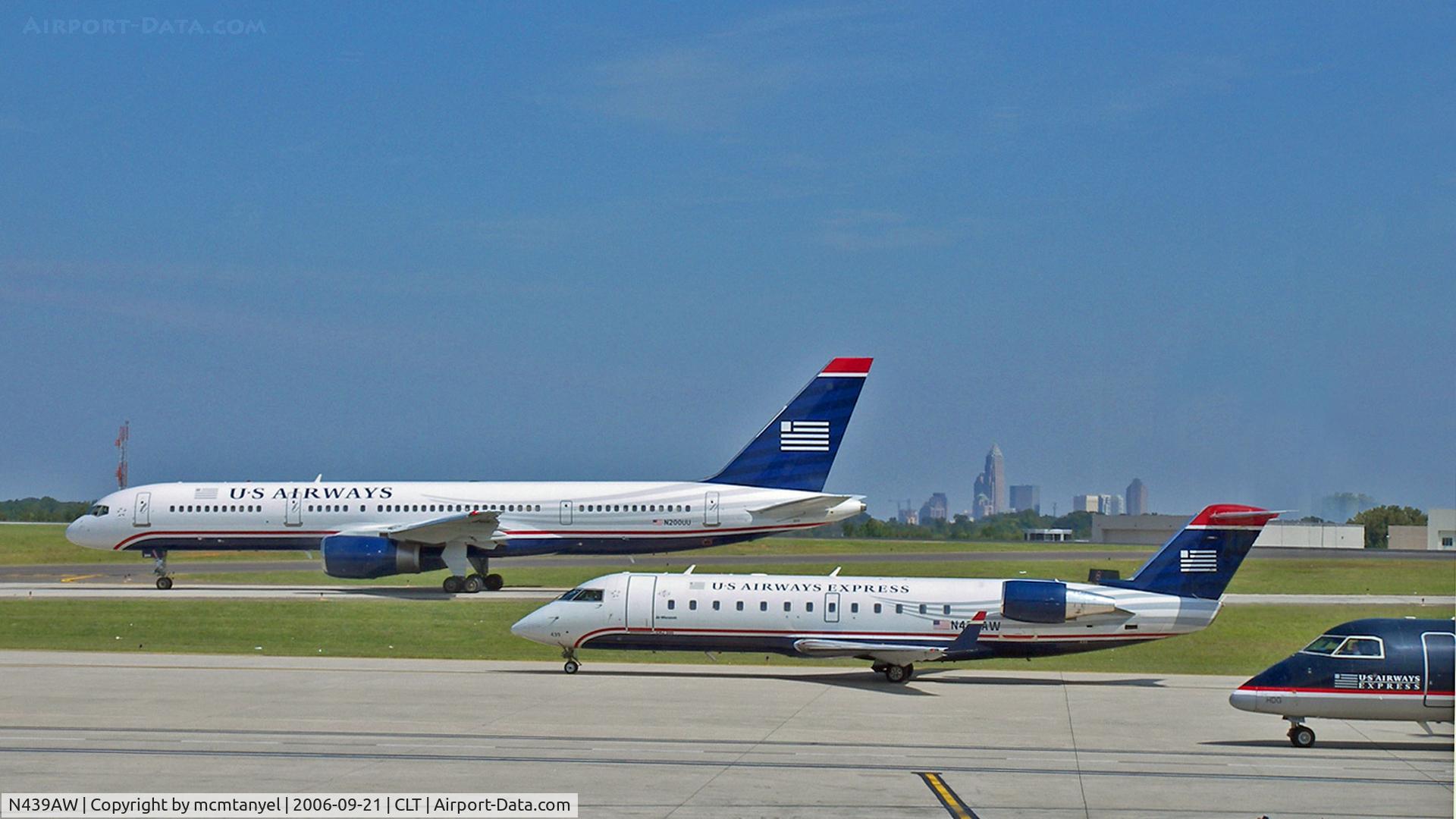 N439AW, 2003 Bombardier CRJ-200LR (CL-600-2B19) C/N 7753, A U S Airways Boeing B757, a U S Airways Express Bombardier CL-600-2B19 and a U S Airways Express Dash-8 taxiing at Charlotte/Douglass International Airport.