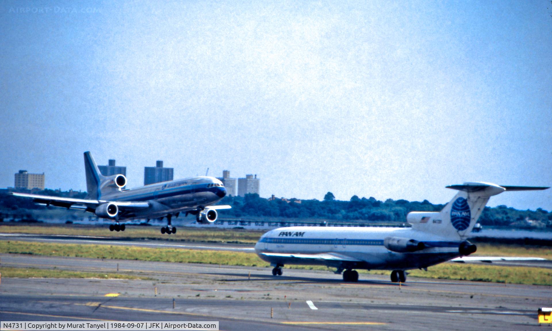 N4731, 1967 Boeing 727-235 C/N 19451, Taxiing to take off while an Eastern Tristar is landing at JFK