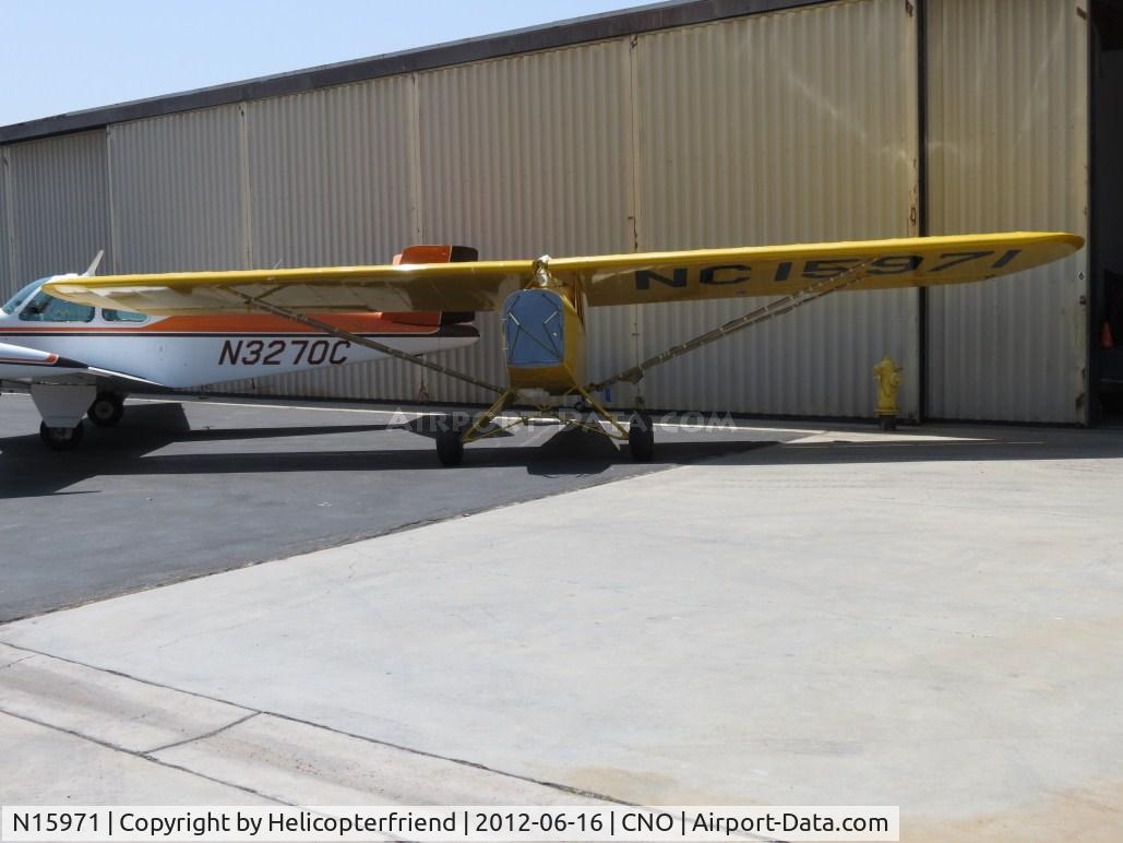 N15971, 1935 Piper J-2 C/N 515, Parked by a hanger & being worked on