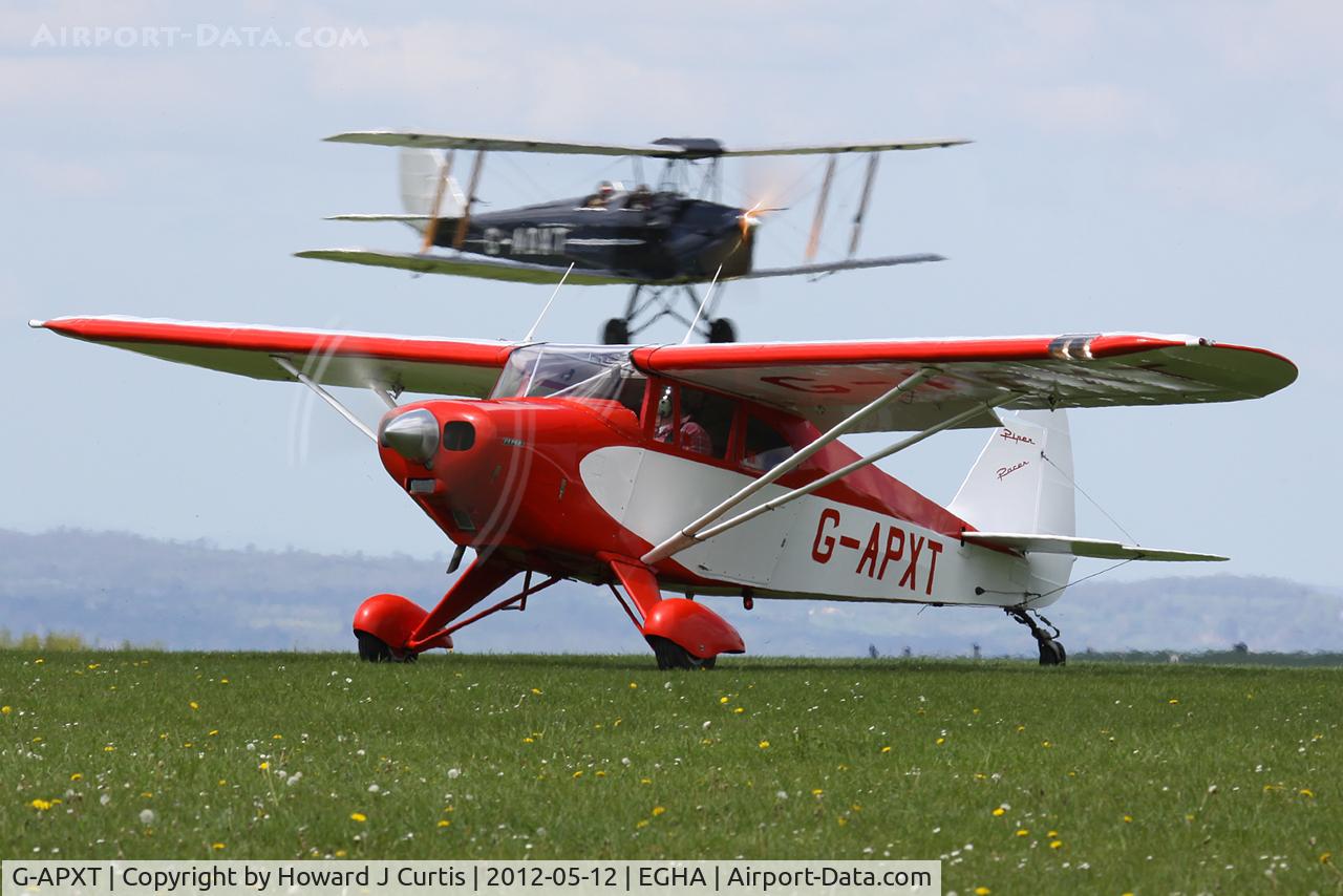G-APXT, 1956 Piper PA-22-150 Caribbean C/N 22-3854, With resident Tiger Moth G-ADXT departing behind.