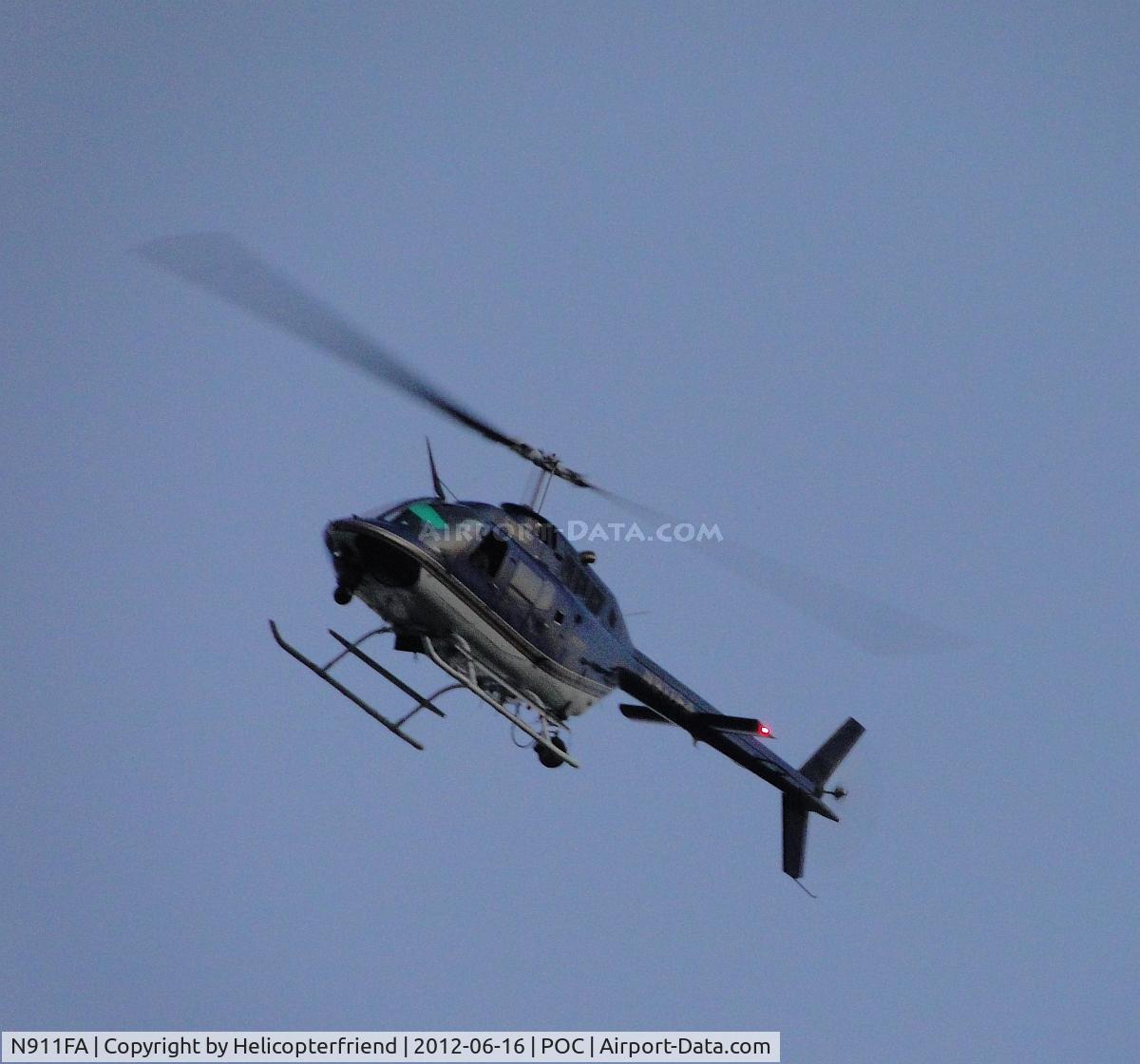 N911FA, Bell OH-58A Kiowa C/N 70-15152, Passing directly over the house while orbiting