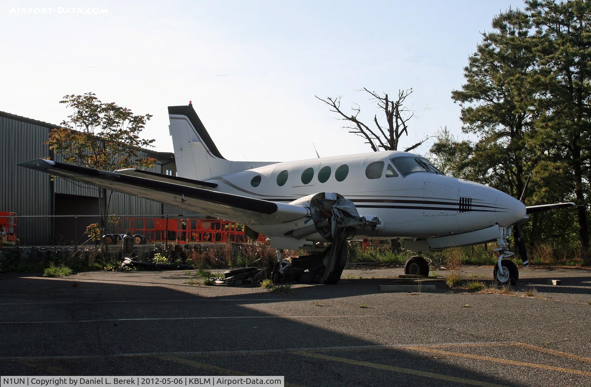 N1UN, 1967 Beech 65-88 Queen Air C/N LP-45, With an engine missing and flattened tires, this poor guy has obviously occupied this parking spot for a long time.