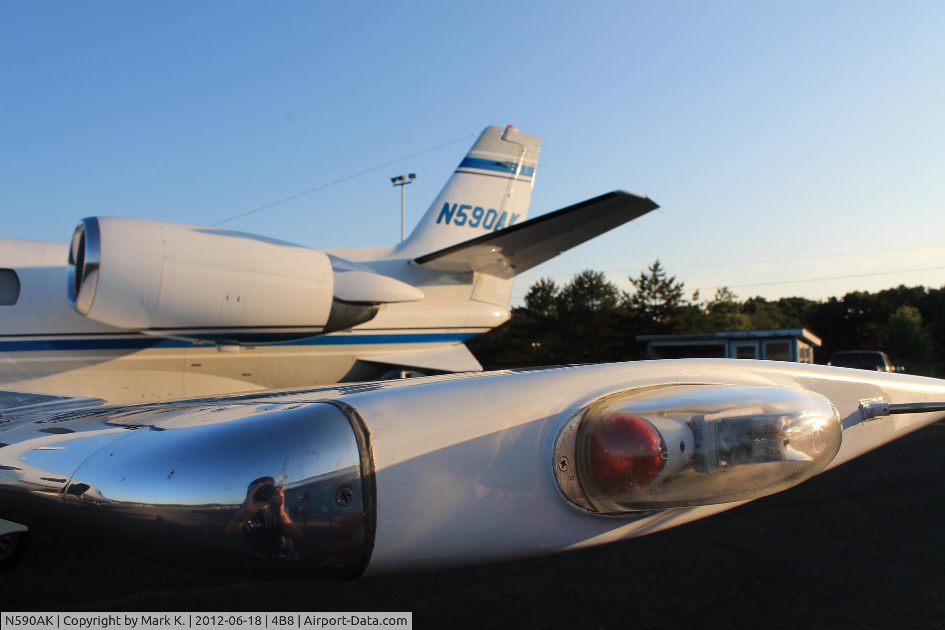 N590AK, 1999 Cessna 560XL Citation Excel C/N 560-5038, The navigation and strobe lights, and the tail.