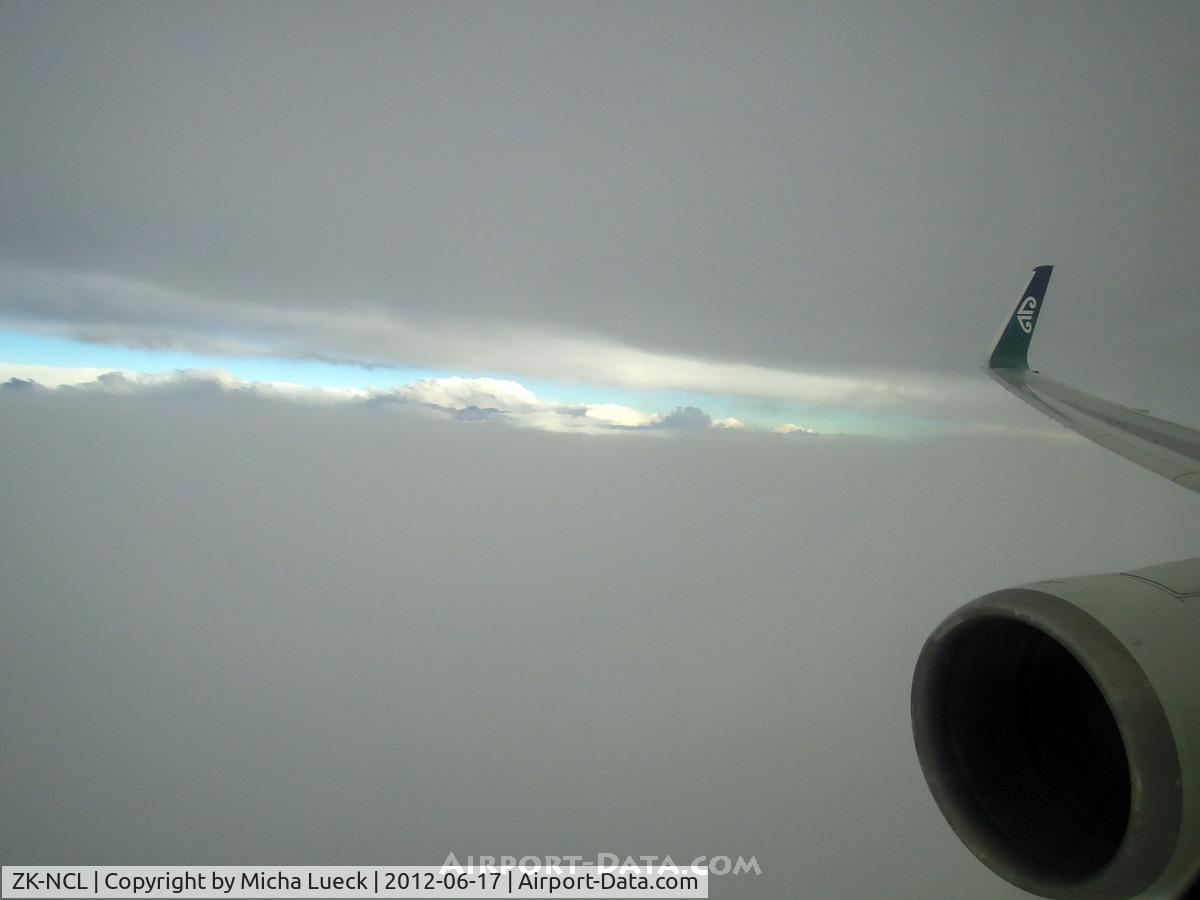 ZK-NCL, 1997 Boeing 767-319/ER C/N 28745, Between two massive cloud layers (NRT-AKL)