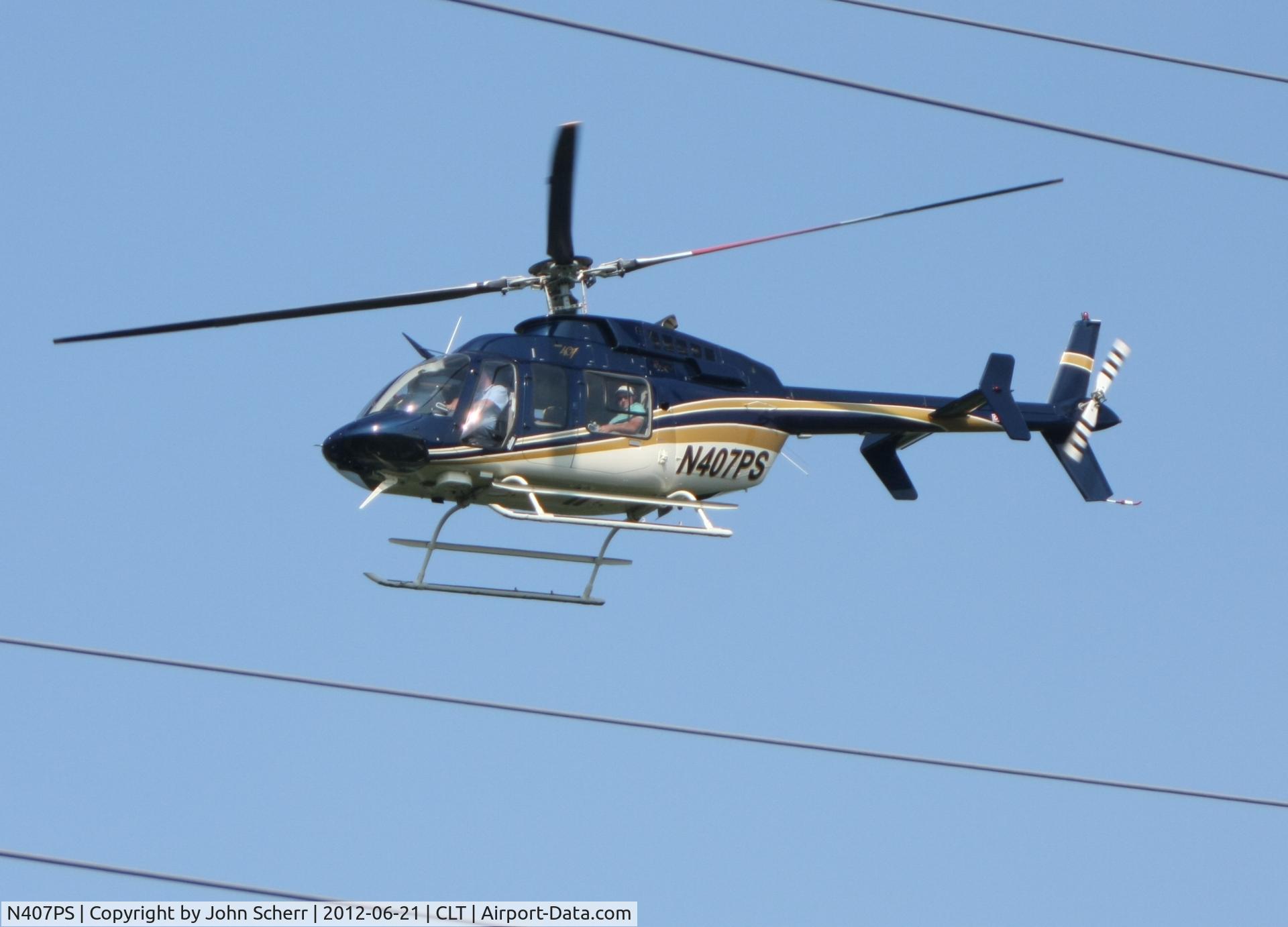 N407PS, 2001 Bell 407 C/N 53467, While walking along the greenway, this bird flew over at very low altitude.  At first, I thought it was the police looking for the squatters who have been living on the bridge over the creek.