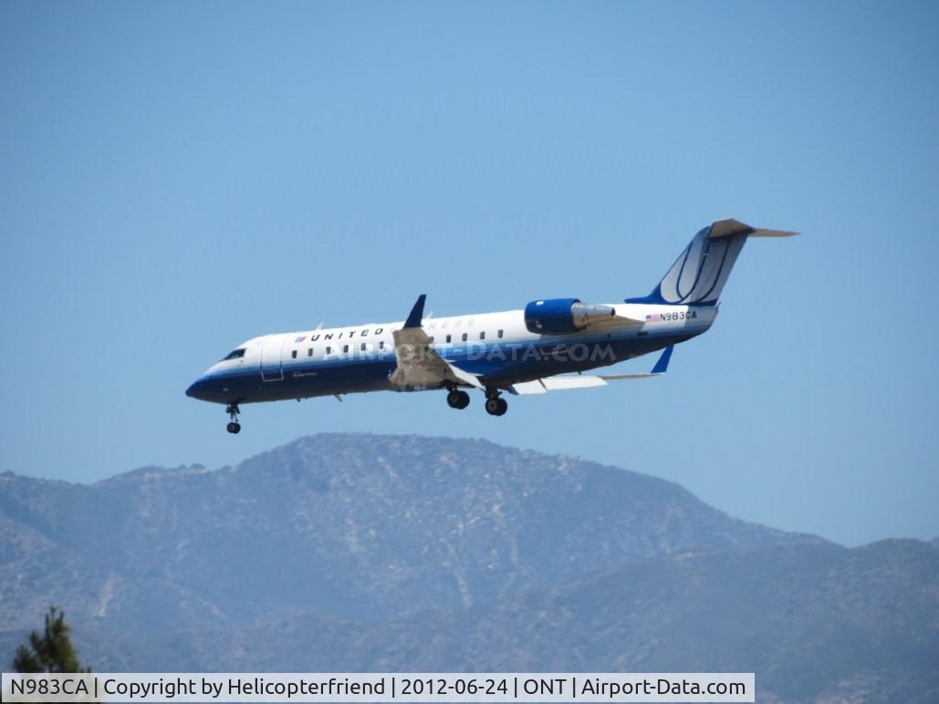 N983CA, 1997 Canadair CRJ-100ER (CL-600-2B19) C/N 7169, Passing over the outer fence