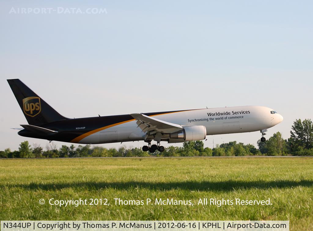 N344UP, 2011 Boeing 767-34AF C/N 37866, UPS B-763 (heavy) touching down on 9R at PHL.