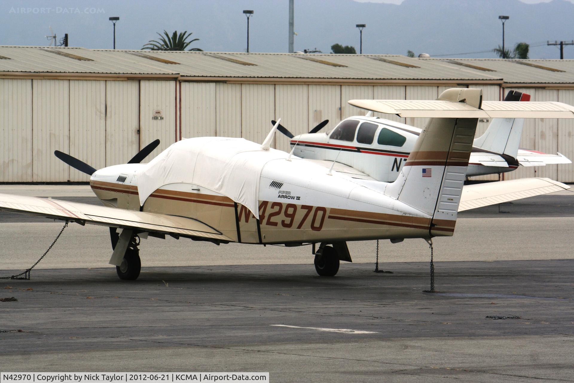 N42970, 1983 Piper PA-28RT-201T Arrow IV C/N 28R-8331030, Parked by the wash rack
