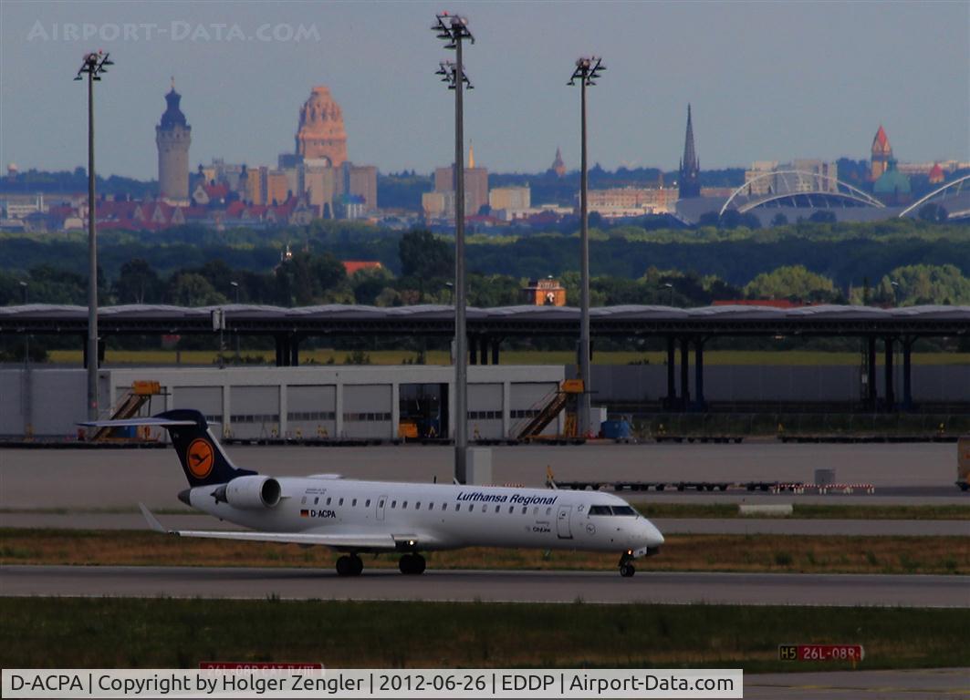 D-ACPA, 2001 Canadair CRJ-701ER (CL-600-2C10) Regional Jet C/N 10012, Take-off on rwy 26 L with a beautiful view to Leipzig center.