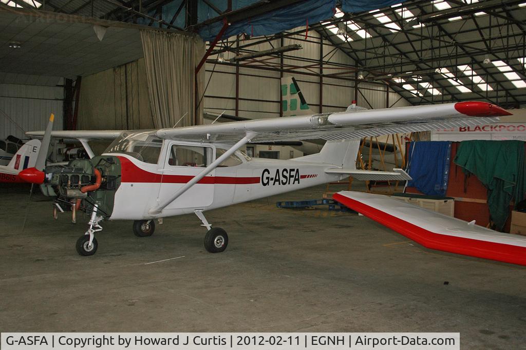 G-ASFA, 1963 Cessna 172D C/N 17250182, Hangared with the engine cowling off.