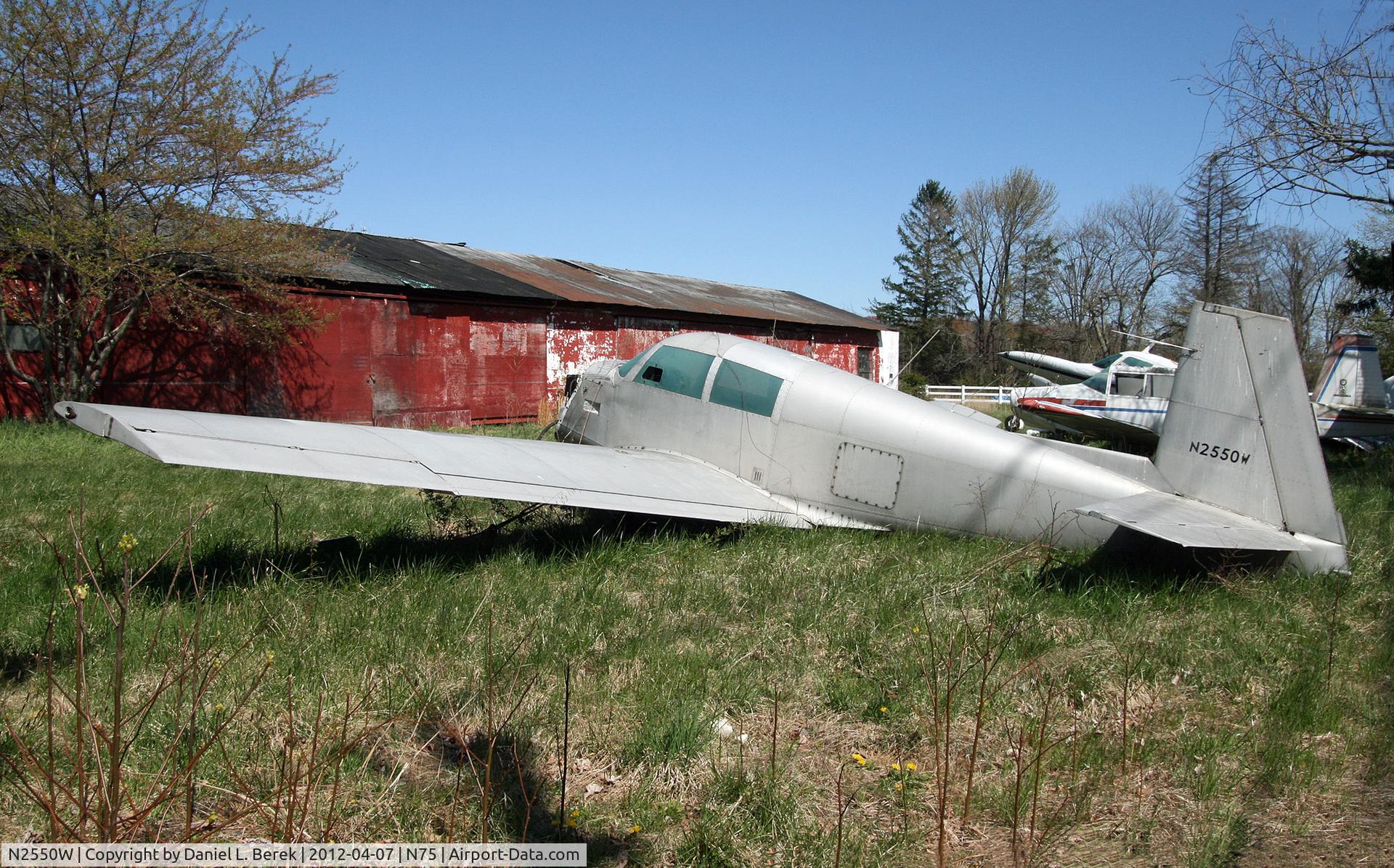 N2550W, 1965 Mooney M20C Ranger C/N 3264, Without its engine and teetering on its main gear, this Mooney Ranger definitely looks much worse for the wear since I saw her last four years ago, before she was moved - or rather dumped - on the front lot of the old Twin Pine Airport, which is slowly be