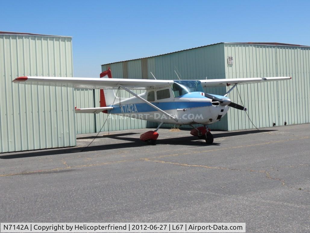 N7142A, 1956 Cessna 172 C/N 29242, Parked between hangers