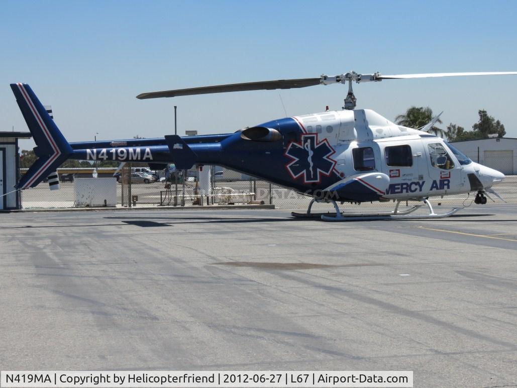 N419MA, 1984 Bell 222UT C/N 47518, Parked outside Mercy Air helipad area, while working on N226LL