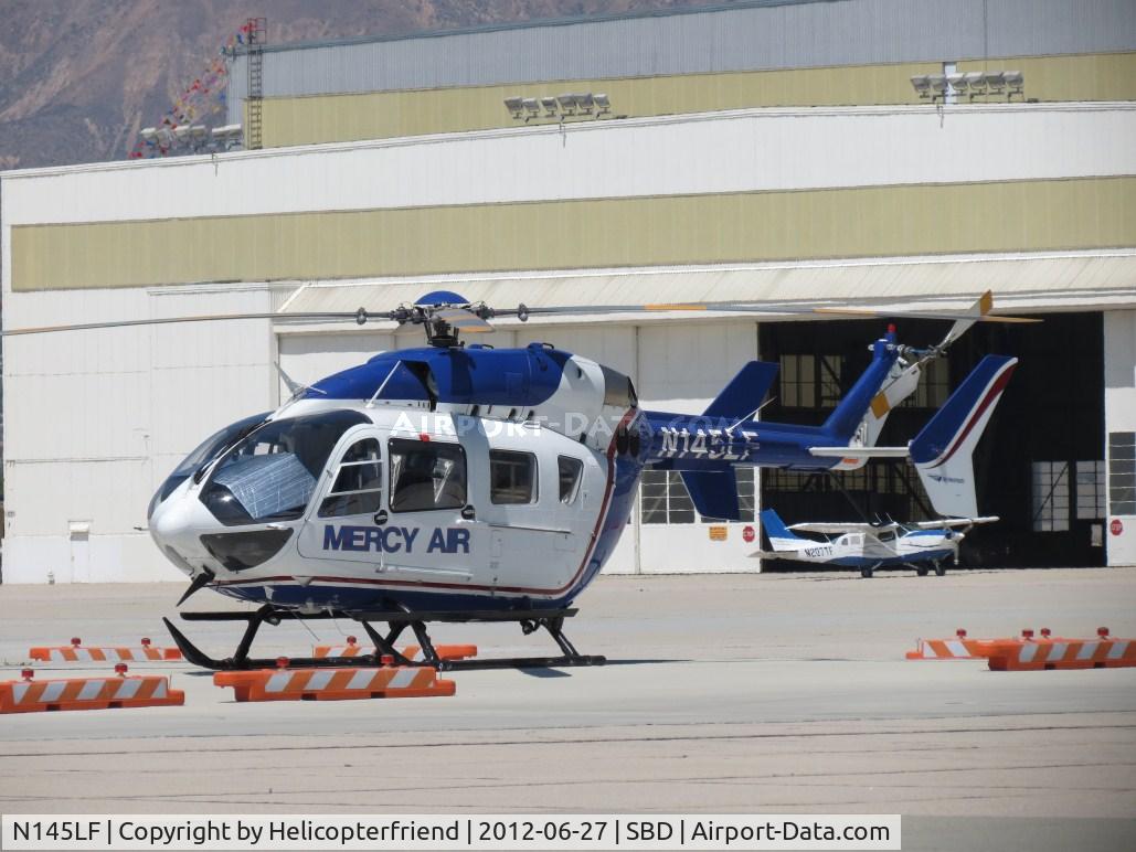 N145LF, 2005 Eurocopter-Kawasaki EC-145 (BK-117C-2) C/N 9072, Parked at the Fire Station area with N207TF in the background