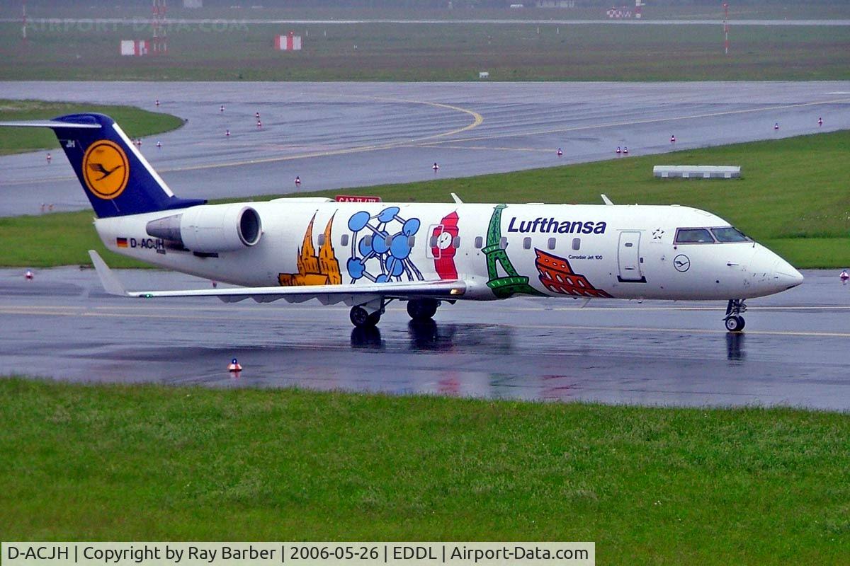D-ACJH, 1998 Canadair CRJ-200LR (CL-600-2B19) C/N 7266, Canadair CRJ-100LR [7499] (Lufthansa Regional)  Dusseldorf~D 26/05/2006. Taxiing in the rain for departure.