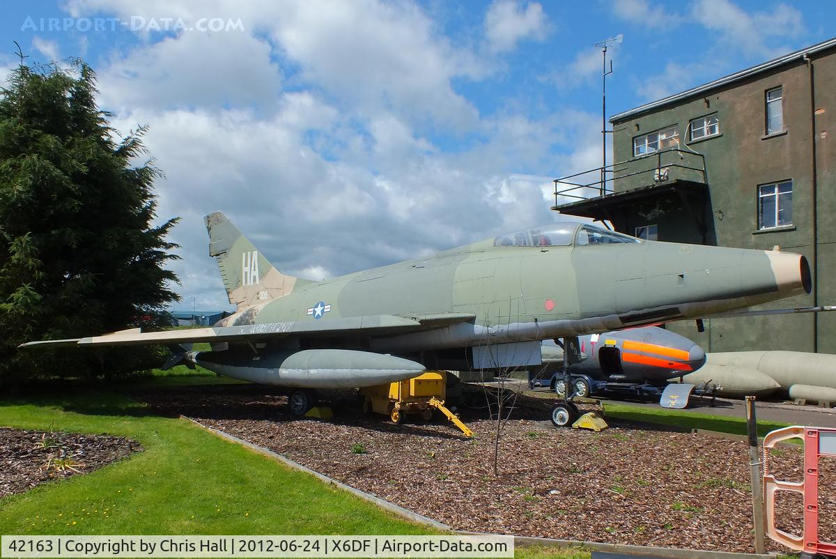 42163, North American F-100D Super Sabre C/N 223-43, Former French Air Force F-100D now painted in USAF markings as 54-2163 and dedicated to the US Air National Guard and is depicted as one flown by Capt. John M. Haley, 174th TFS, Iowa Air National Guard, during the squadron’s tour in Vietnam.