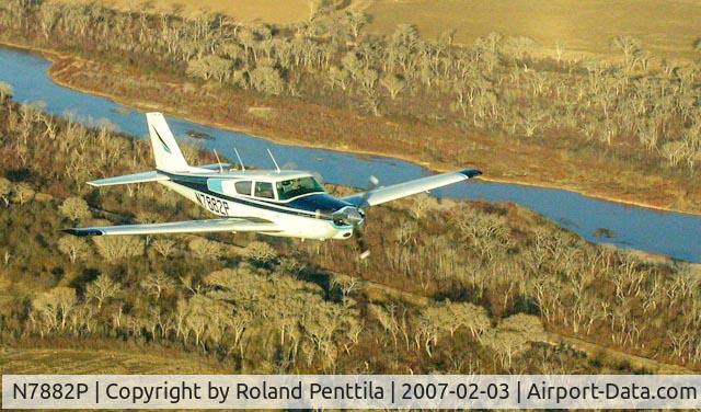 N7882P, 1962 Piper PA-24-250 Comanche C/N 24-3110, Piper Comanche 250 flying over the Rio Grande just south of Albuquerque.