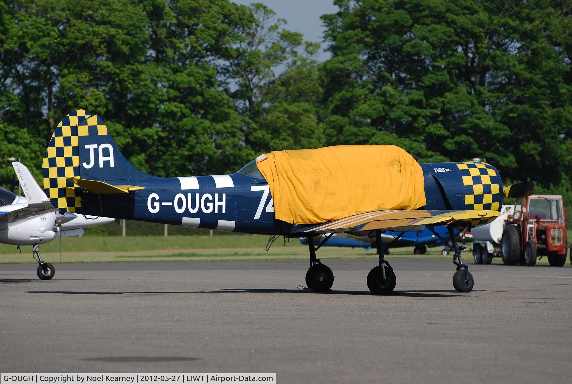 G-OUGH, 1987 Bacau Yak-52 C/N 877404, Seen parked on the ramp at Weston.