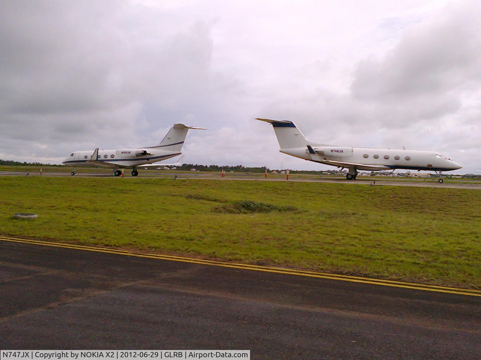 N747JX, 1968 Grumman G-1159 C/N 33, BOTH N747JX and N748JX PARKED IN LIBERIA