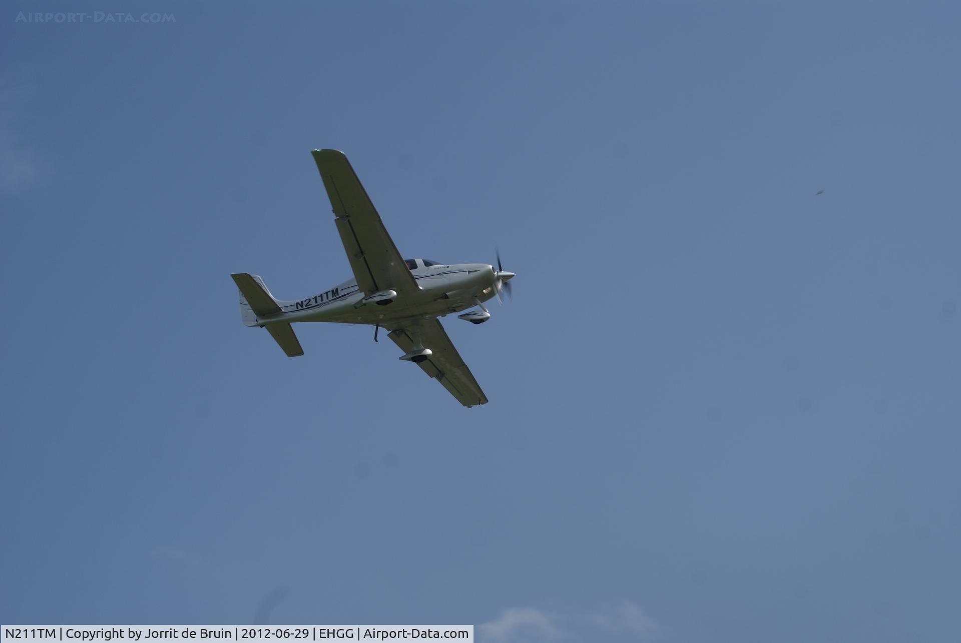 N211TM, Cirrus SR22 GTS Turbo C/N 3572, It does not seem like a landing, but it is. The Cirrus SR22 from General Enterprises was landing on runway 23 of Eelde.