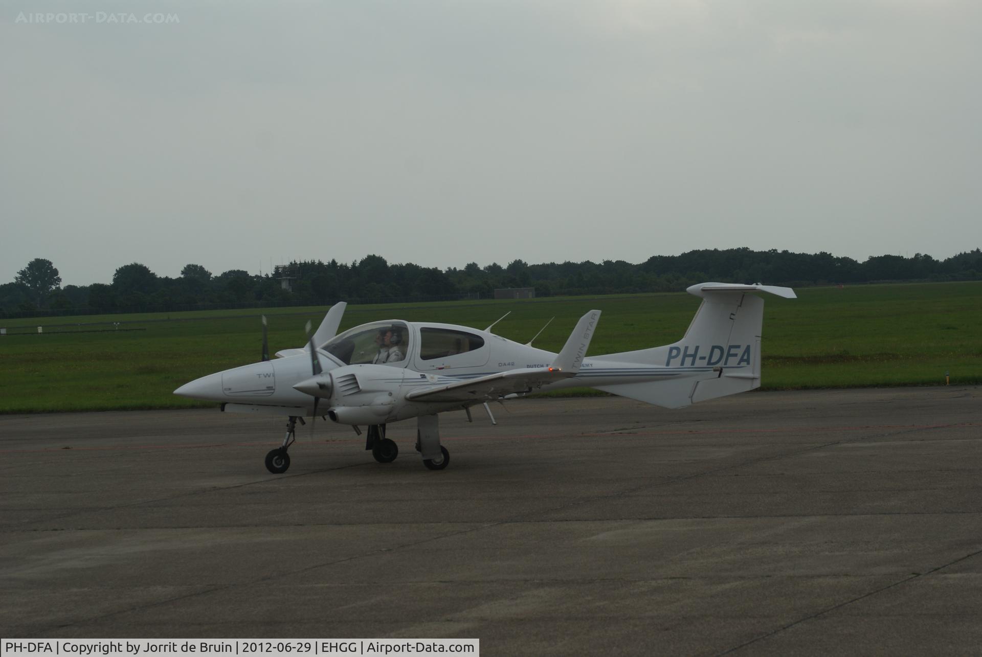 PH-DFA, Diamond DA-42 Twin Star C/N 42.088, This time not parked in the hanger, but just to park in front of tower to go the Airport Office after a flight with a world of touch and goes.