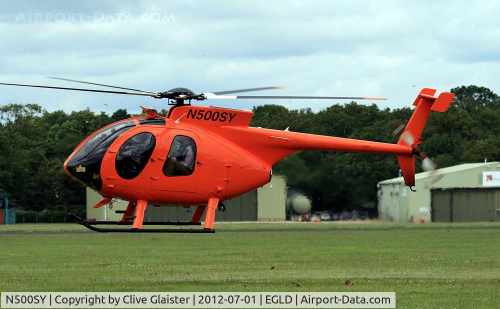 N500SY, 1983 Hughes 369E C/N 0007E, This MDH 369E was previously registered, N5144Q which was used by, Simon Oliphant-Hope of Eastern Atlantic Helicopters to circumnavigate the globe in 2004. A new world record at 17 days, 14 hours, 2 minutes and 27 seconds as N5144Q. There's a video interv