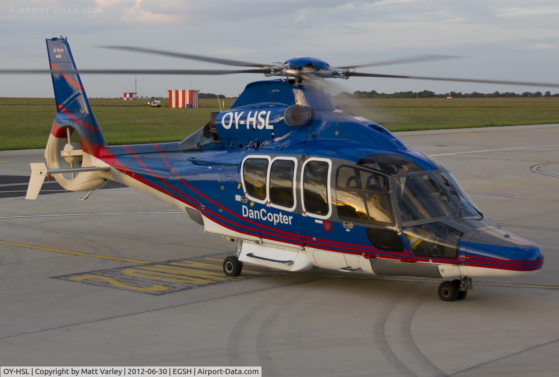 OY-HSL, 2003 Eurocopter EC-155B-1 C/N 6658, Sat on stand at SaxonAir after arriving in the setting sun.