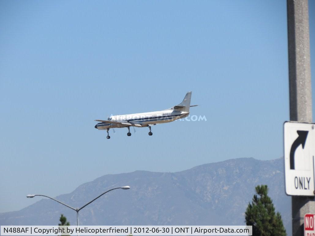 N488AF, 1981 Fairchild Swearingen SA-227AC Metro III C/N AC-488, Over the outer fence nd starting to descend
