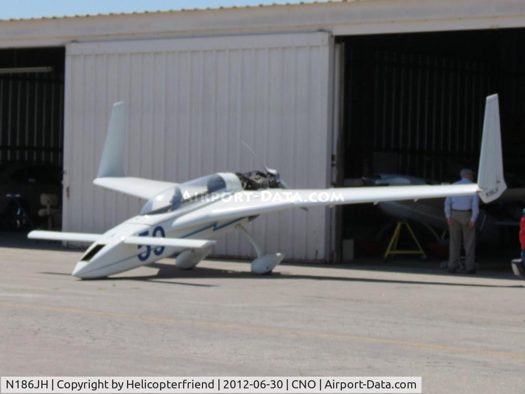 N186JH, Rutan Long-EZ C/N 1459, Kneeling outside a hanger with engine cowling off