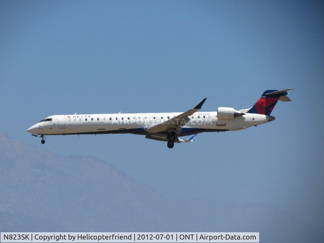 N823SK, 2008 Bombardier CRJ-900ER (CL-600-2D24) C/N 15205, On final for 26R