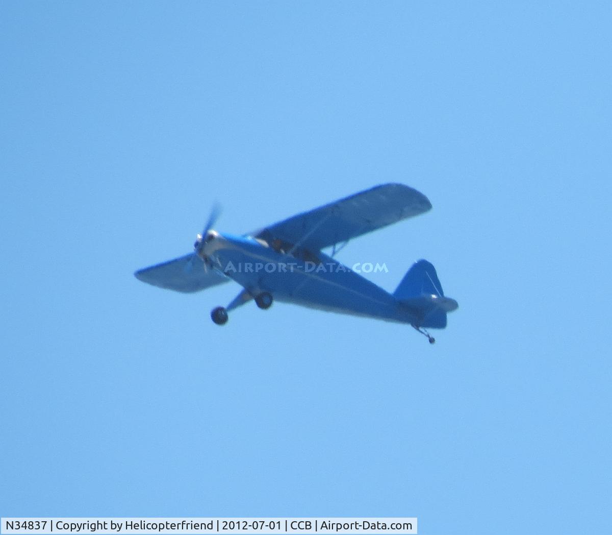 N34837, 1941 Porterfield 75C C/N 1657, Crossing over the field heading northeast