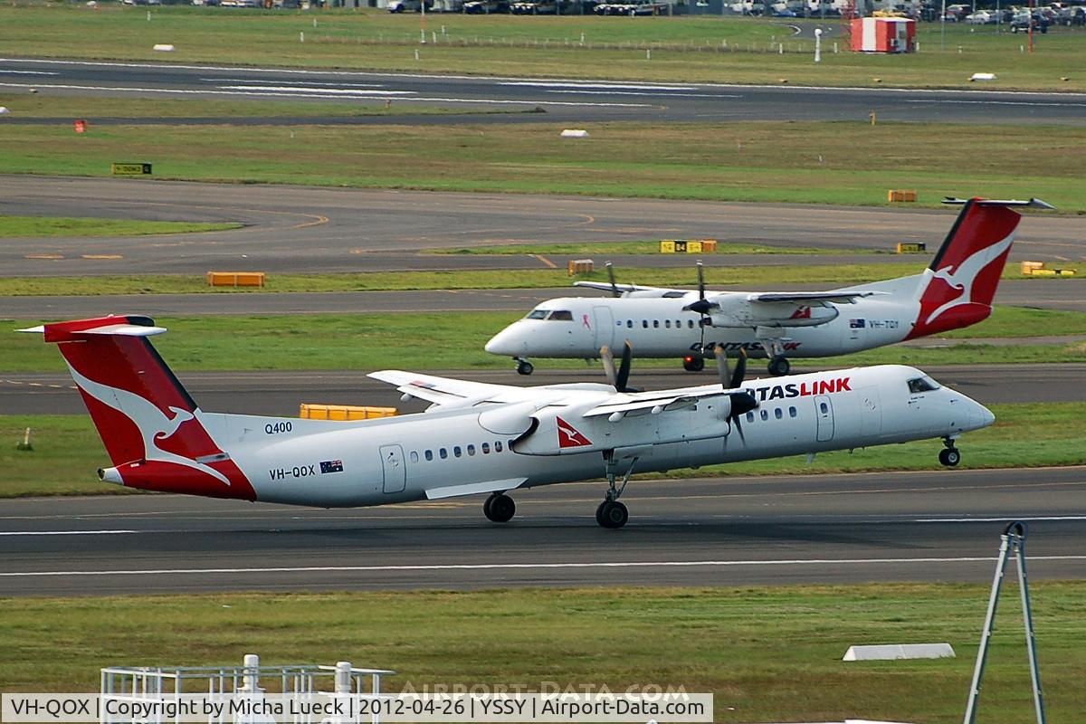 VH-QOX, 2009 De Havilland Canada DHC-8-402Q Dash 8 C/N 4287, With TQY in the background