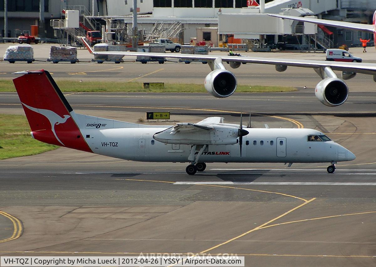 VH-TQZ, 2000 De Havilland Canada DHC-8-315Q Dash 8 C/N 555, The Dash-8 easily fits under the wing of a B747...