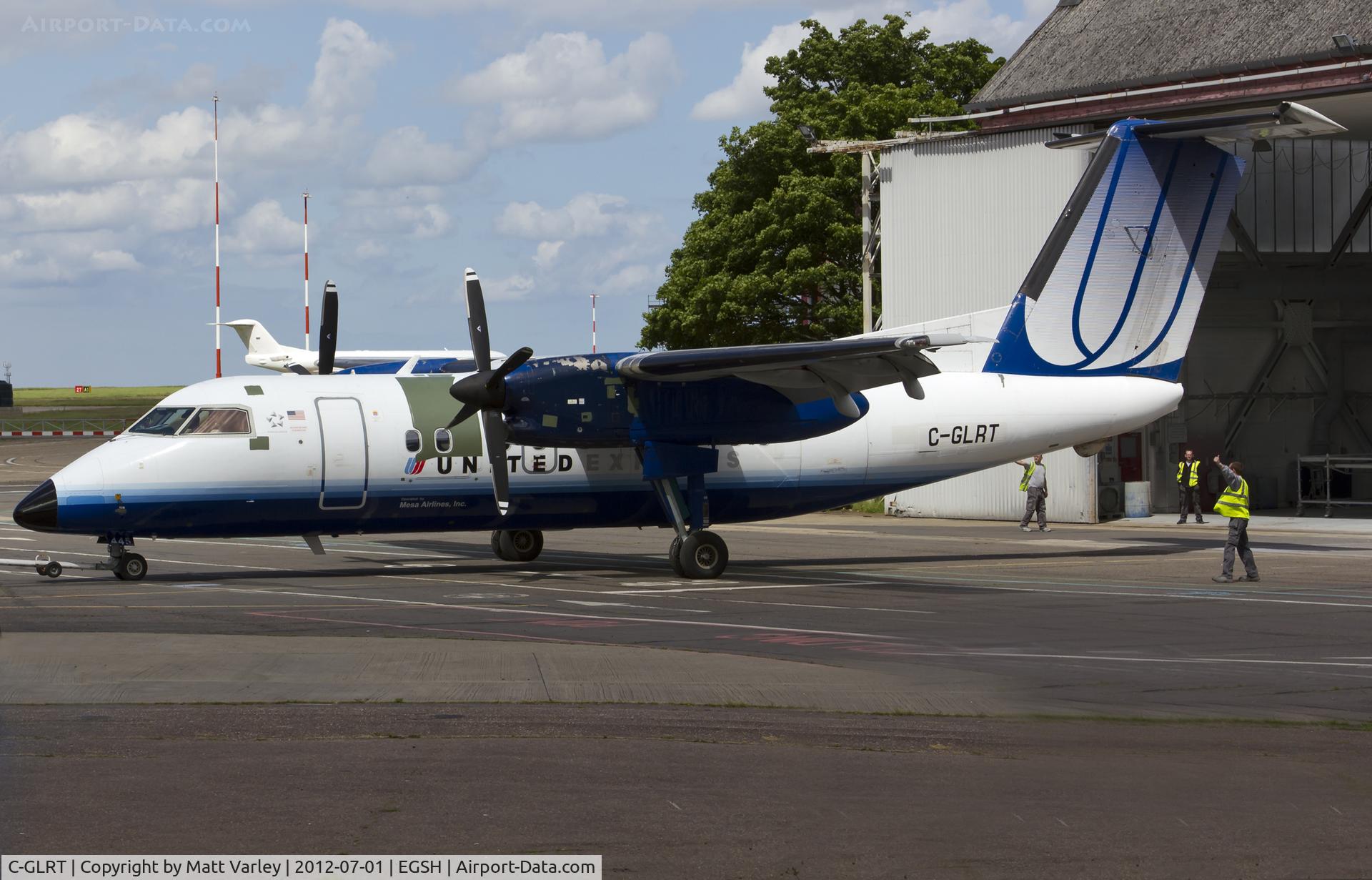 C-GLRT, 1996 De Havilland Canada DHC-8-202 Dash 8 C/N 445, Being pushed into the Air Livery hangar.