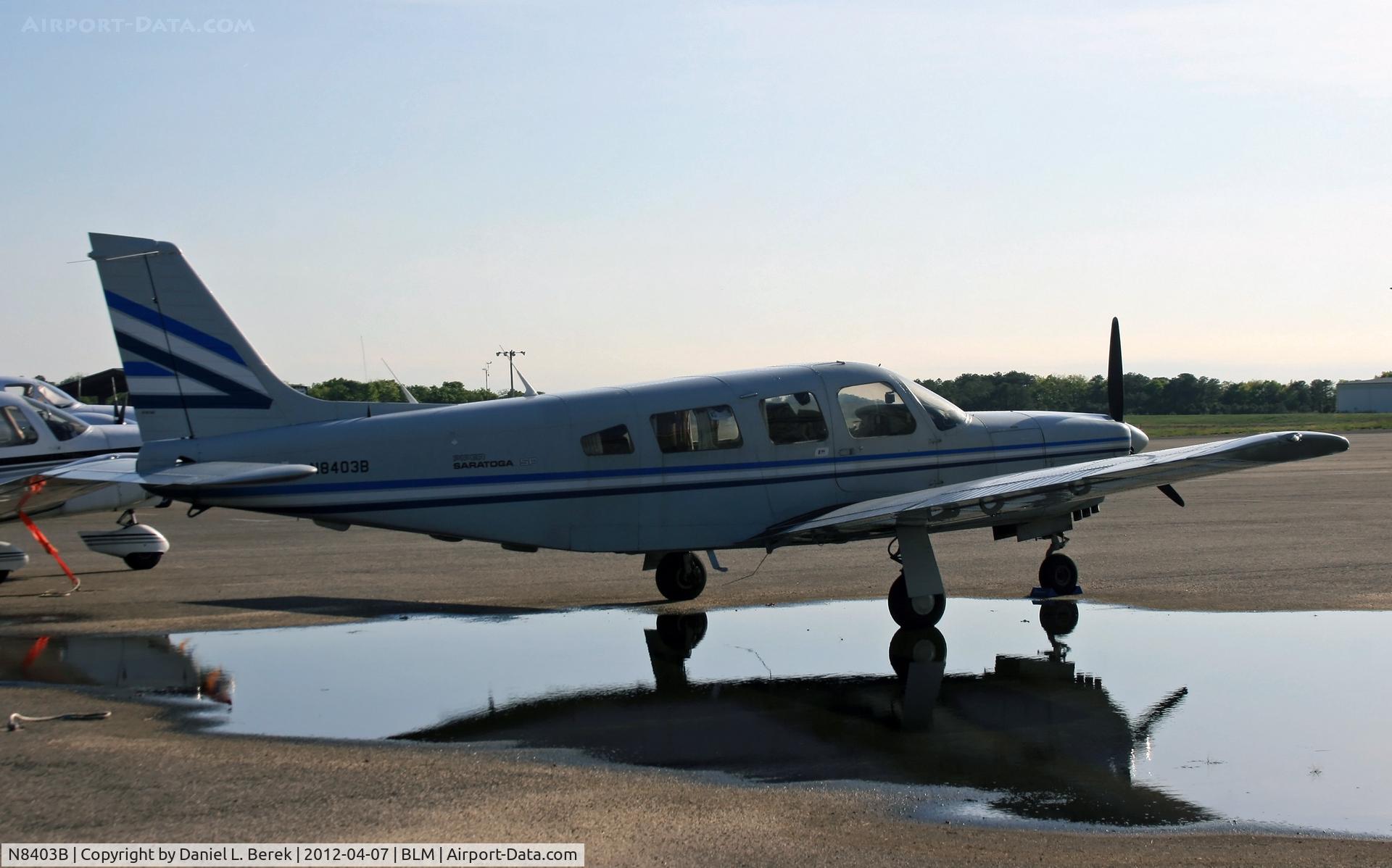 N8403B, 1981 Piper PA-32R-301 C/N 32R-8113082, A 1981 Piper Saratoga makes a nice reflection in a recent rain puddle.