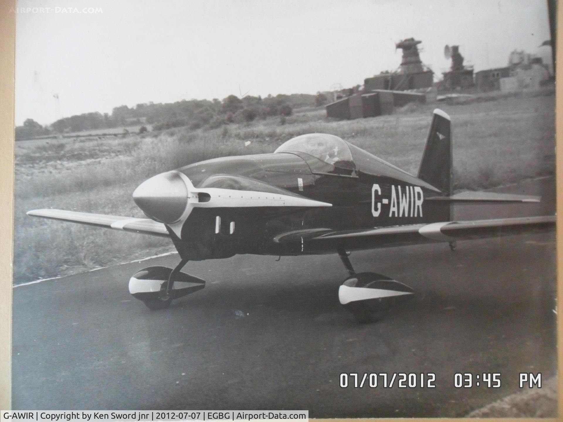 G-AWIR, 1973 Mustang Aeronautics Midget Mustang MM-1 C/N PFA 1315, the owner and builder Ken Sword taxying from the hangar at leicester where it was built and based .picture is of a B&W print i have at home 