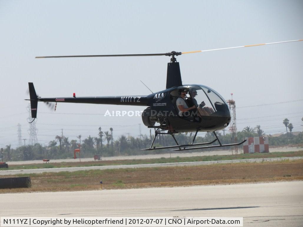N111YZ, 1990 Robinson R22 BETA C/N 1622, Air taxiing westbound