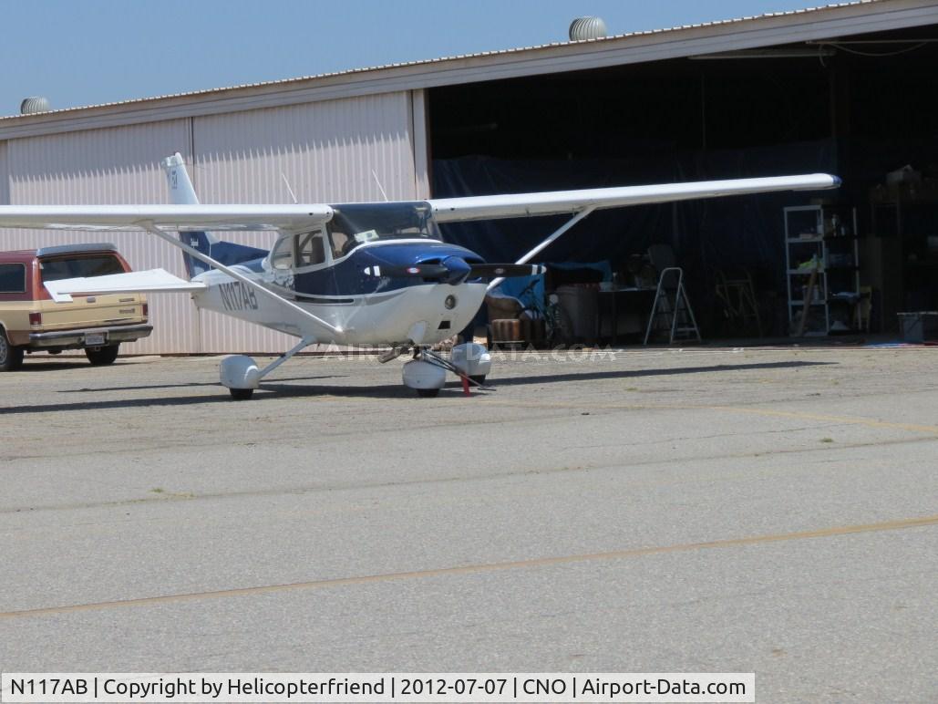 N117AB, 1978 Cessna 172N C/N 17271253, Parked near a hanger