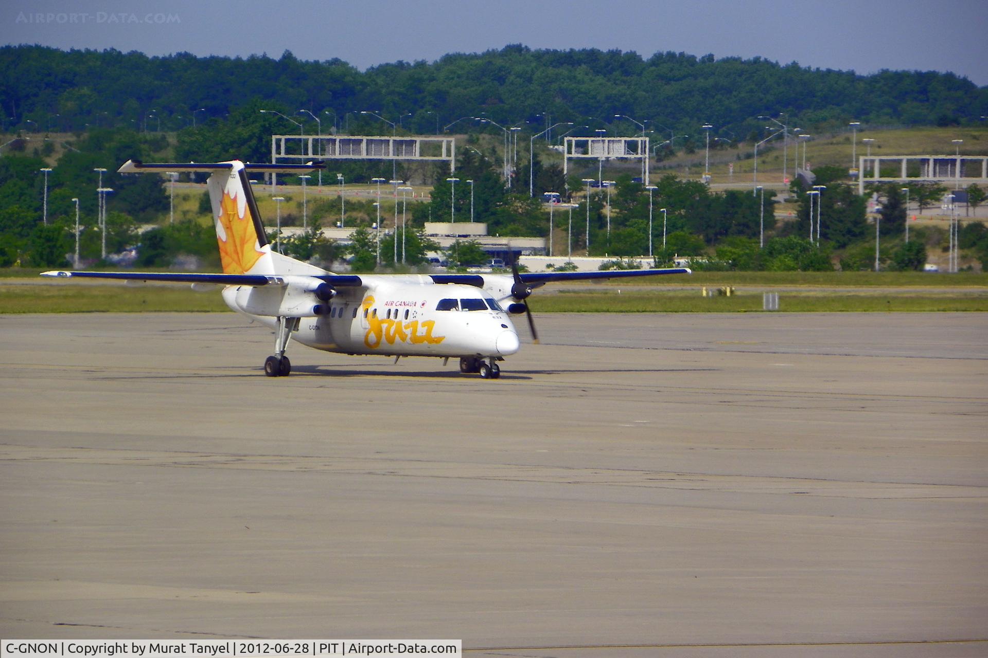 C-GNON, 1989 De Havilland Canada DHC-8-301 Dash 8 C/N 137, Taxiing to gate at PIT.